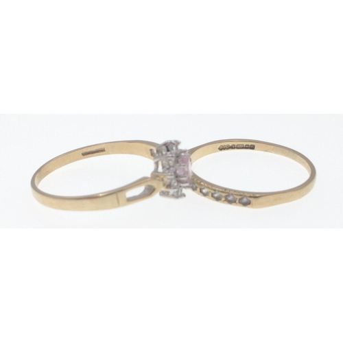 16 - Two 375 yellow gold Hallmarked rings, one set with 9 small clear stones, size O, gross weight 1.1g a... 