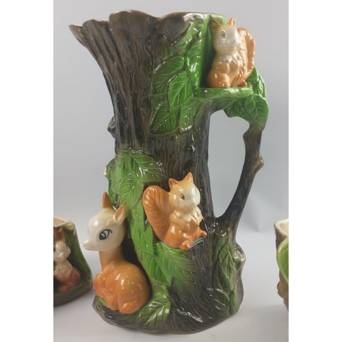 257 - A collection of WITHERNSEA EASTGATE FAUNA POTTER and a crack at the lip), a plantpot holder (approx ... 