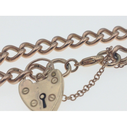 30A - A 375 stamped yellow gold bracelet weight 23.20g approx with a nice love heart-shaped locket#34