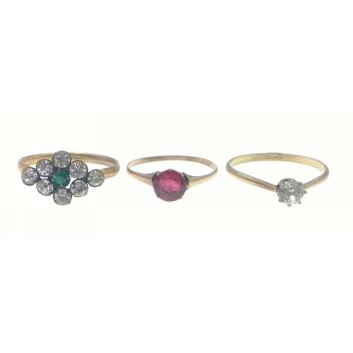 47 - A TRIO OF RINGS to include one stamped Rolled Gold with diamond setting with green and white stones,... 