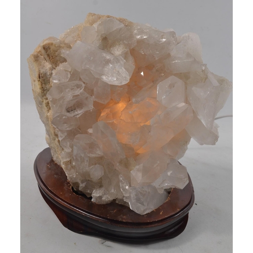 482 - A large STUNNING SPECIMEN piece of ROCK CRYSTAL thought to be from BRAZIL, ON A BASE, which lights-u... 