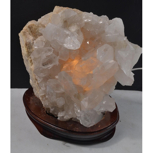 482 - A large STUNNING SPECIMEN piece of ROCK CRYSTAL thought to be from BRAZIL, ON A BASE, which lights-u... 