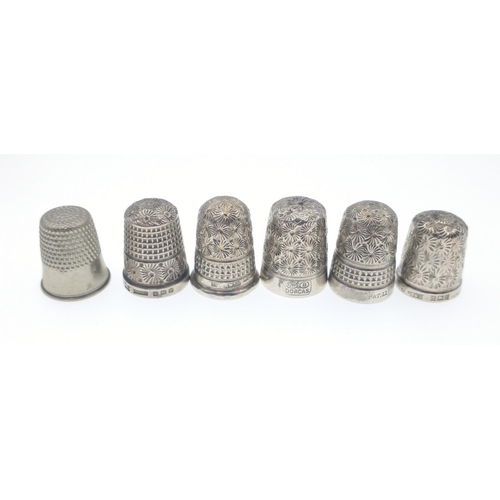 50 - A collection of 5 assorted silver Hallmarked thimbles and one white metalweight total 29.7g gross ap... 