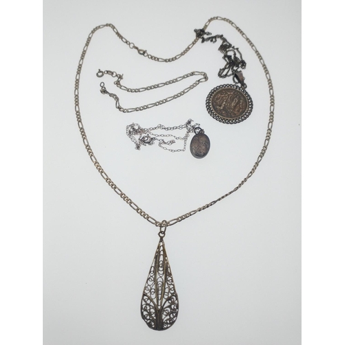 57 - A collection of jewellery to include a filigree white metal pendant on a 925 stamped silver chain, g... 