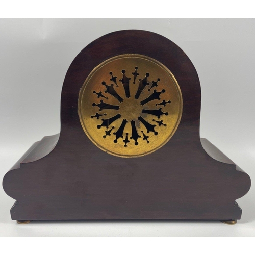 88 - An attractive mantlepiece clock with a metal clockface stands 24cm high, still retains key#103