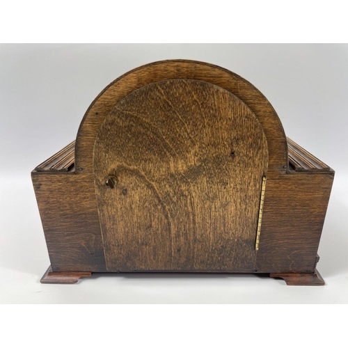 91B - A circa 1930's oak cased mantle clock 8 day striking ( which is ticking away quite happily on valuat... 