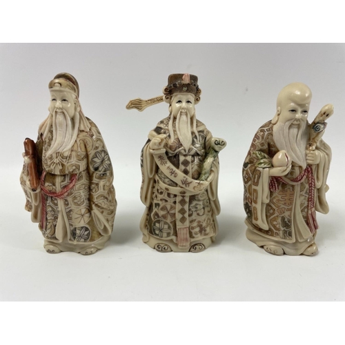 106 - A set of three carved ORIENTAL WISE MEN standing approx 10cm high#108