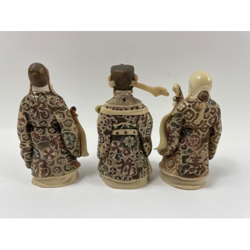106 - A set of three carved ORIENTAL WISE MEN standing approx 10cm high#108