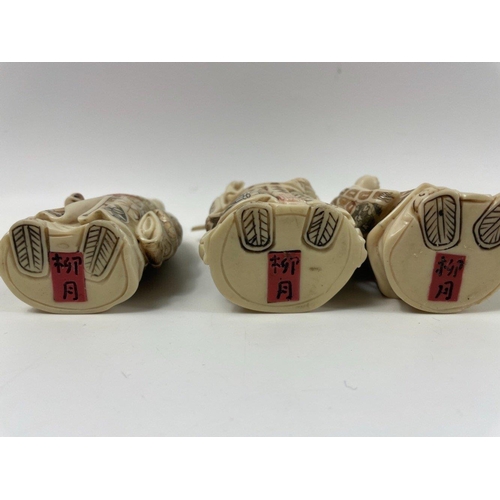 106 - A set of three carved ORIENTAL WISE MEN standing approx 10cm high#108