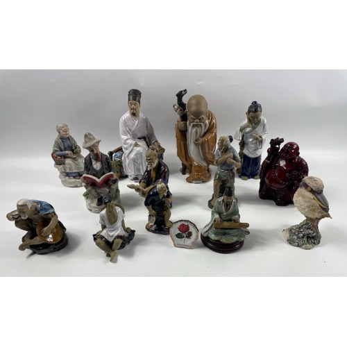 107 - A collection of 9 mudmen, tallest 25cm, plus a laughing buddha and others, some damage#109