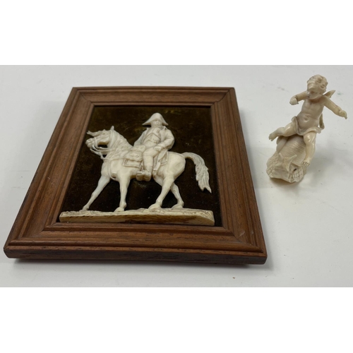 404 - A winged cherub astride a large snail dimensions 5cm x 5.5cm, and a small framed Napoleon astrde a h... 