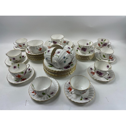 80 - A ROYAL WORCESTER ASTLEY part tea service to include 8 teacups, 7 large coffee/cappuccino cups, 8 pl... 