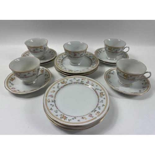 85 - A pretty Chinese tea service with gilt rims (small chip on one cup) to include 6 cups, 6 saucers and... 