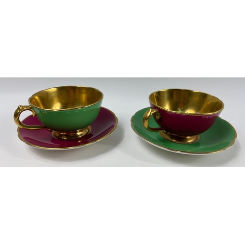 86 - A vintage pair of small PARAGON harlequin cups and saucers by appointment to HM the Queen and HM Que... 
