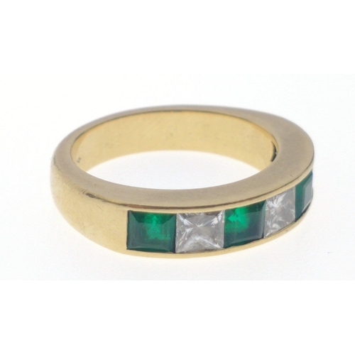 10 - A SUBSTANTIAL 750 hallmarked yellow gold RING size O/P set with four large cut EMERALDS 4mm length a... 