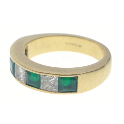 10 - A SUBSTANTIAL 750 hallmarked yellow gold RING size O/P set with four large cut EMERALDS 4mm length a... 