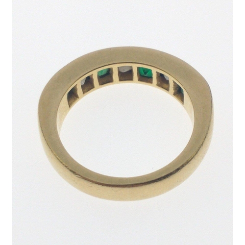 10 - A SUBSTANTIAL 750 hallmarked yellow gold RING size O/P set with four large cut EMERALDS 4mm length a... 