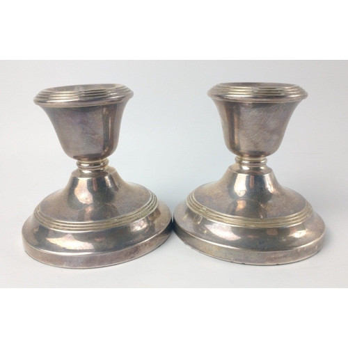 143 - A pair of Dublin hallmarked 1975 small CANDLESTICKS by silversmith JEWELLERY & METAL MANUFACTURING C... 