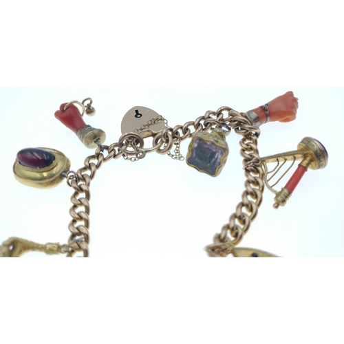 37 - SIMPLY EXQUISITE!!! A VICTORIAN 9ct stamped yellow gold charm BRACELETwith 10 charms, to include two... 