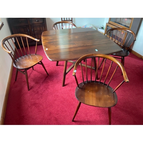 374 - An ERCOL dining table complete with ERCOL tag dimensions 135cm x 112cm and four ERCOL style round ba... 