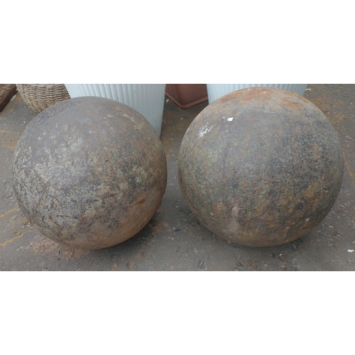 385 - Two LARGE HEAVY METAL decorative balls with a hole in the bottom for fixing etc - prob sat on top of... 