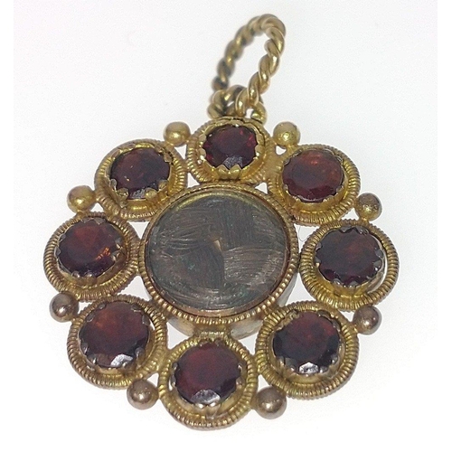 41 - NICE QUALITY! VINTAGE 'yellow metal' mourning PENDANT set with 8 garnets surrounding woven hair, dim... 