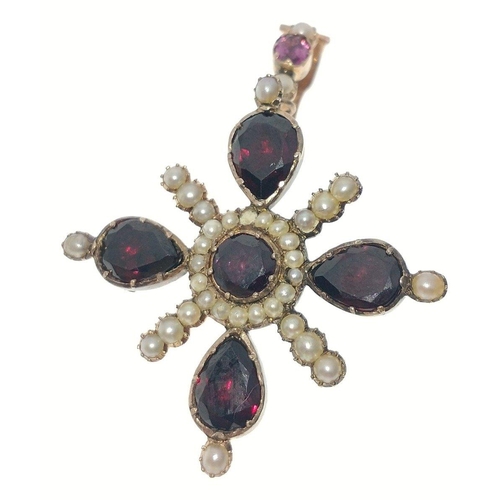 52 - A VICTORIAN 'yellow metal' PENDANT in star shape form, with 4 large garnets 1cm in length, and with ... 