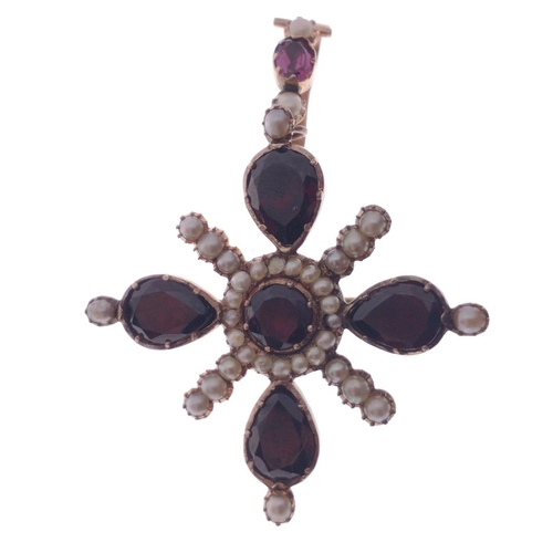 52 - A VICTORIAN 'yellow metal' PENDANT in star shape form, with 4 large garnets 1cm in length, and with ... 