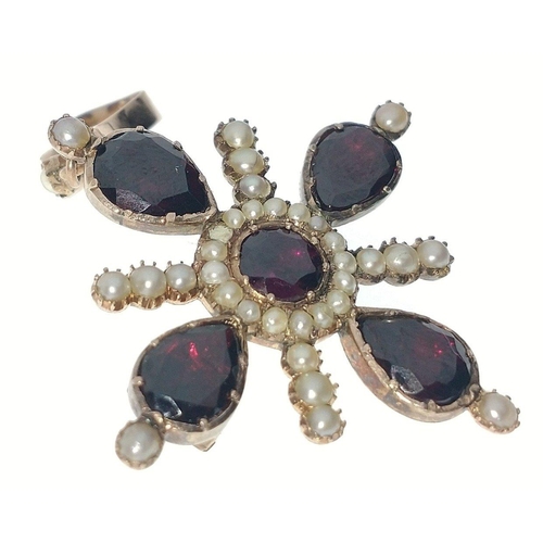 52 - A VICTORIAN 'yellow metal' PENDANT in star shape form, with 4 large garnets 1cm in length, and with ... 