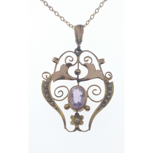 54 - A VINTAGE 9ct stamped yellow gold ornate PENDANT with seed pearls flanking an amethyst on a 9k stamp... 