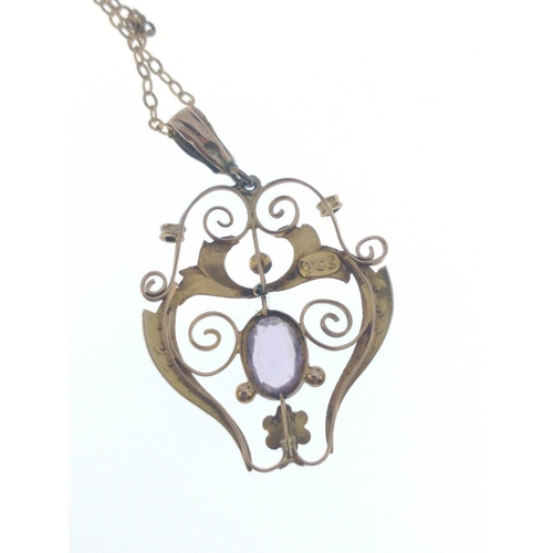 54 - A VINTAGE 9ct stamped yellow gold ornate PENDANT with seed pearls flanking an amethyst on a 9k stamp... 