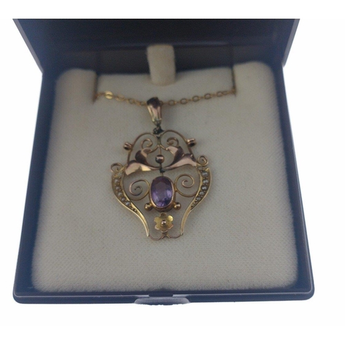 54 - A VINTAGE 9ct stamped yellow gold ornate PENDANT with seed pearls flanking an amethyst on a 9k stamp... 