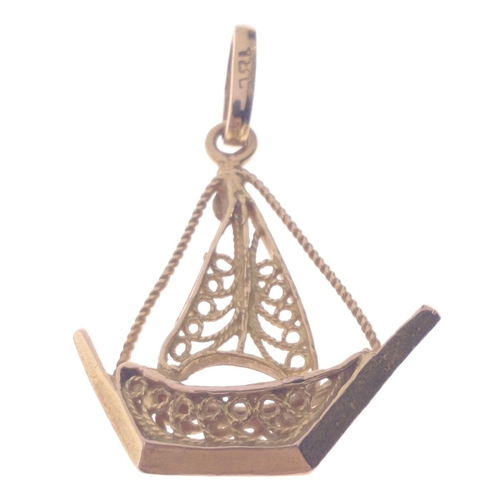 56 - A 750 stamped yellow gold pendant shaped as a dhow length 3.25cm x 2.5cm, gross weight 2.9g#60