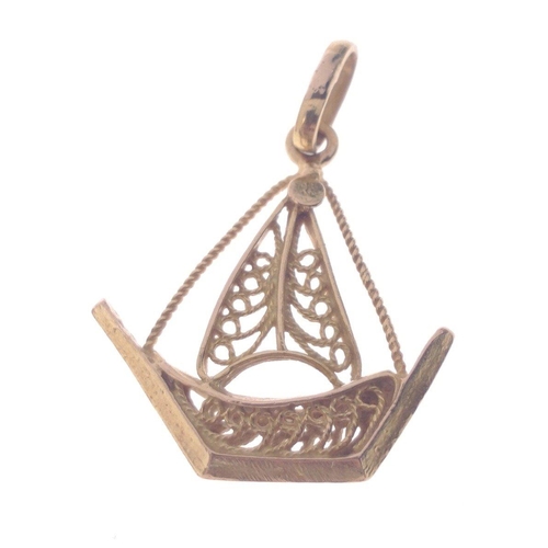 56 - A 750 stamped yellow gold pendant shaped as a dhow length 3.25cm x 2.5cm, gross weight 2.9g#60