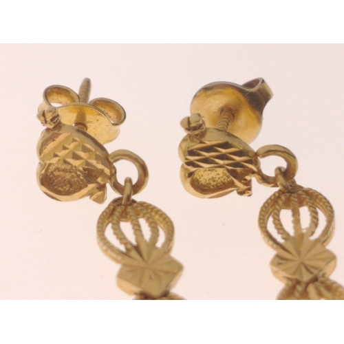 57 - A pair of 18ct yellow gold drop EARRINGS, top section shaped as a heart with an arrow piercing it, l... 