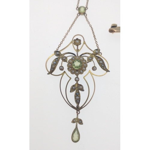 69 - BEAUTIFUL!An early 20th century 9ct stamped yellow gold floral form PENDANT with seed pearls and a c... 