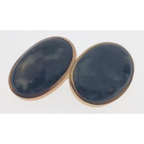 82 - A VINTAGE pair of 'yellow metal' base and greyish/whiteish oval cut stone CUFFLINKS in original Lond... 