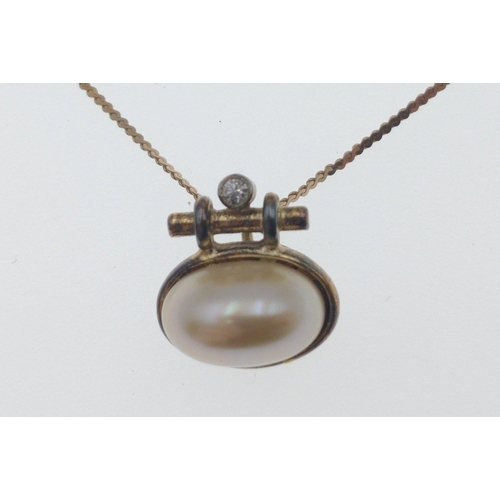 88D - A 9ct gold chain with pearl and white stone pendant, chain 40cm, gross weight 2g plus a pair of pear... 