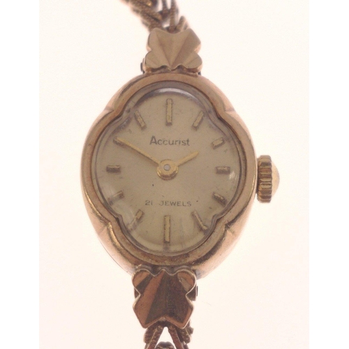 95 - A ladies ACCURIST 9ct gold case wristwatch with 9ct gold strap total length approx 17cm gross weight... 