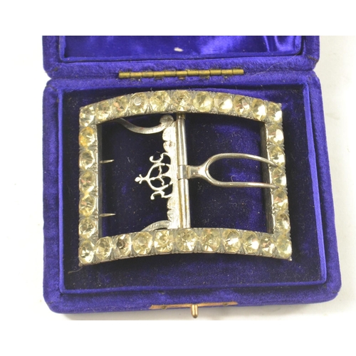 4 - A BLING ART DECO inspired belt buckle with clear paste stones, the buckle on white metal within its ... 