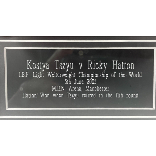 40 - OOUCH!! A boxing glove signed by RICKY HATTON in a frame with a photo of his victory over Kostya Tsz... 