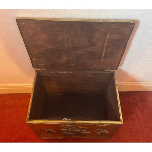 211 - Brass repousse effect log box depicting a ship on the sea with feature lion style handles dimensions... 