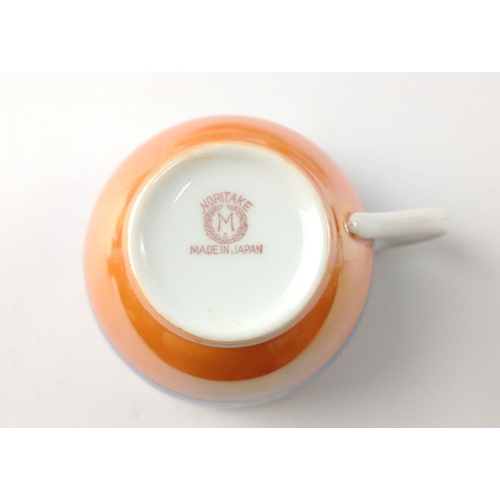 111 - A part NORITAKE tea service in orange lustre ware consisting of 2 cups, 3 saucers and a milk jug#116... 