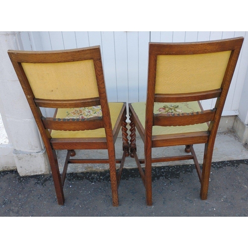 218 - A pair of vintage wooden dining chairs with handworked tapestry back panels and seats with a floral ... 