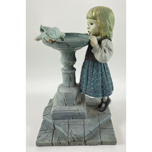 255 - An unusual ENESCO 1999 Piazza Making Friends figurine of a girl and pigeons, stands approx 25cm hi... 