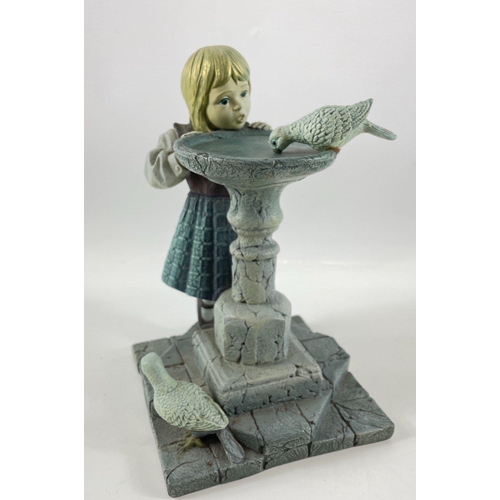 255 - An unusual ENESCO 1999 Piazza Making Friends figurine of a girl and pigeons, stands approx 25cm hi... 