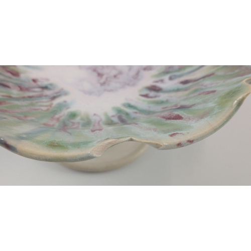 272 - A SCOTTISH STUDIO POTTERY hand painted medium sized raised bowl in pastel green white and red design... 