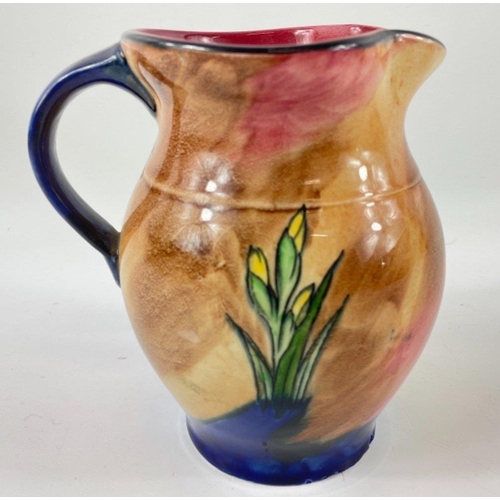 285 - An H&K TUNSTALL hand-painted jug in the iris design standing 14cm tall - c1930's#296