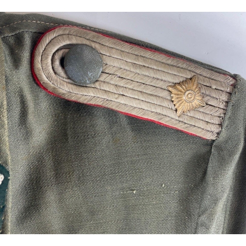 346 - RARE - A WWII German army artillery officer's summer tunic constructed of a lightweight grey cloth w... 