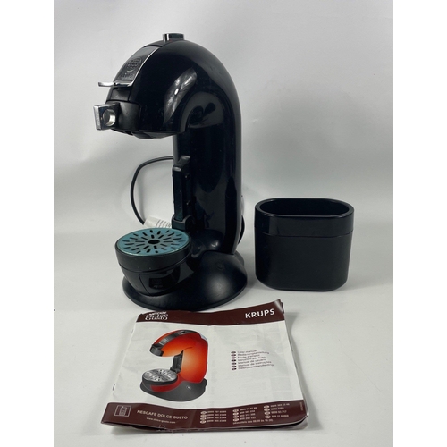 470 - A KRUPS Nescafe DOLCE GUSTO coffee making machine with instructions and box of coffee capsules, type... 